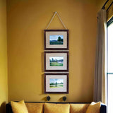 Pack of 3 Dev Aastha hanging photo frames, 5x7 inches, displayed on a wall.